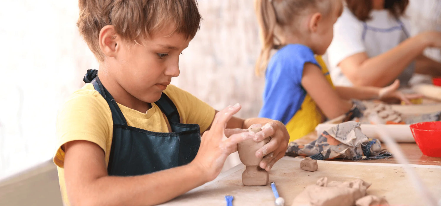 Boy doing Pottery and Clay Work